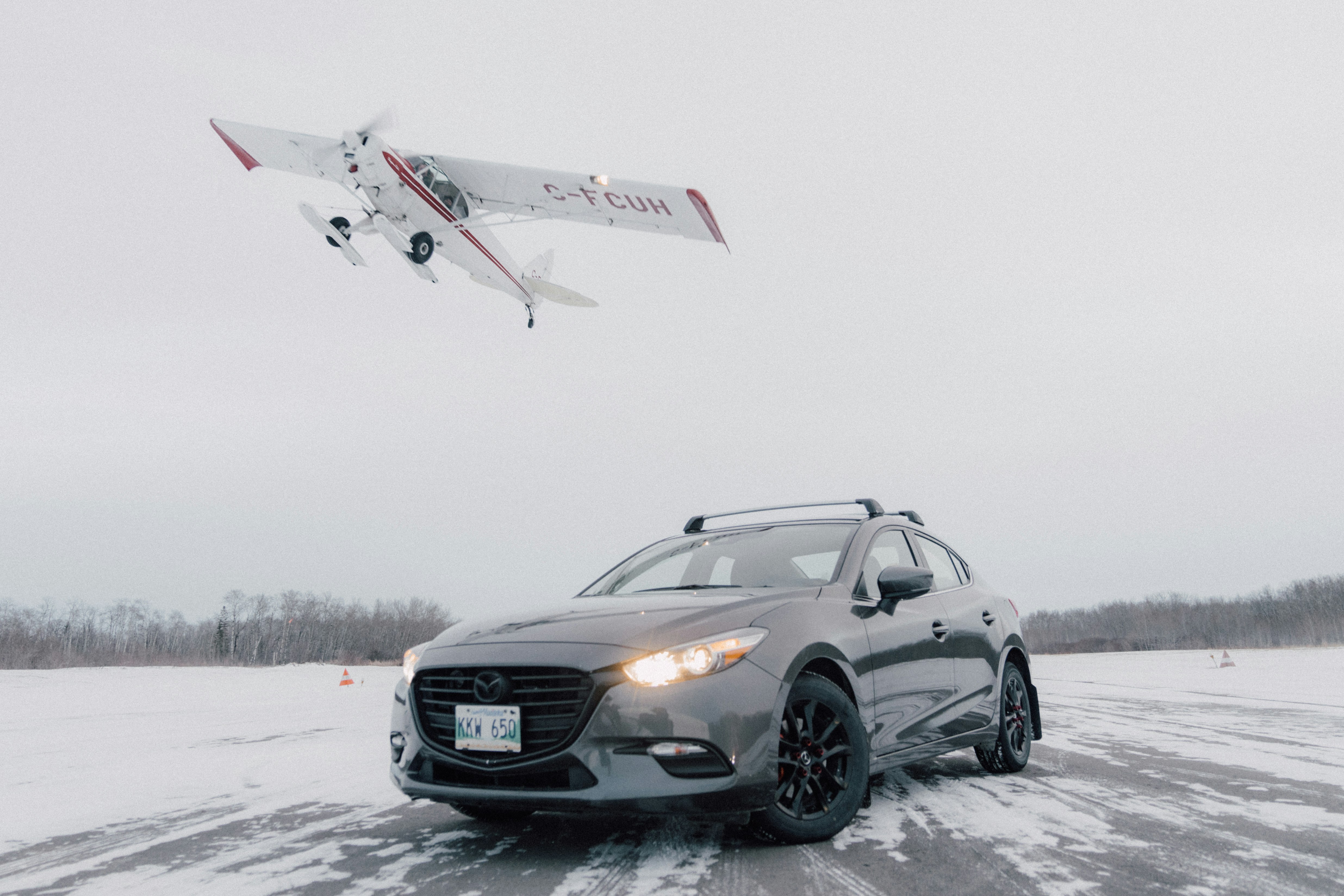 black mercedes benz c class on snow covered ground during daytime